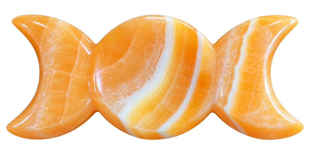 Orange Calcite Triple Moon Goddess Carving showing warm orange stone with white swirl markings
