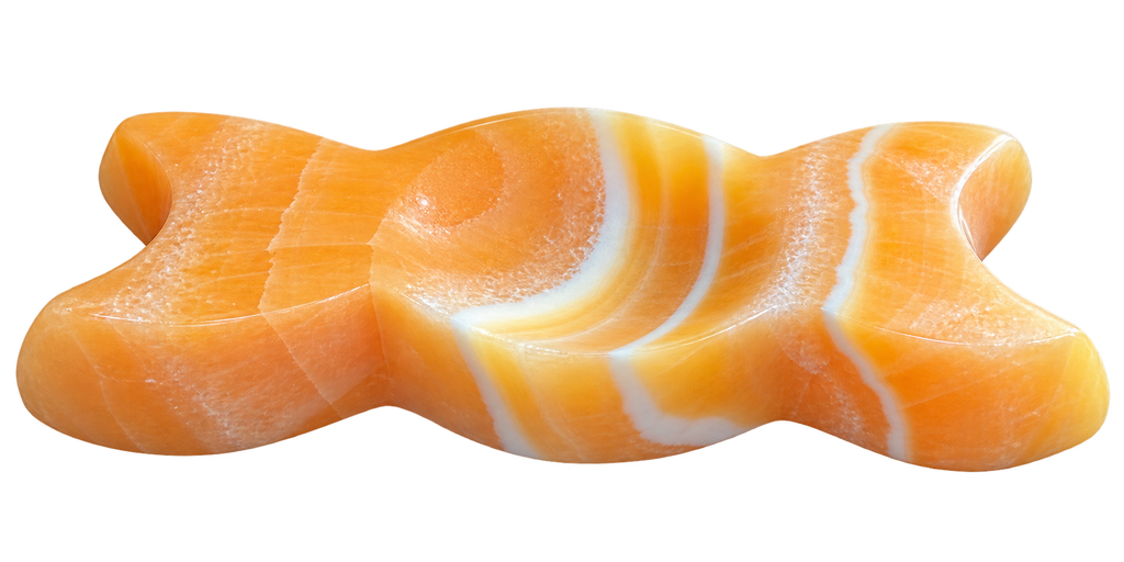 Orange Calcite Triple Moon Goddess Carving side view showing natural stone markings