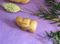 Yellow Aventurine crystal elephant carving side view on purple background with dried botanicals — The Crooked Moon