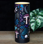 Dark Forest USB Aroma Lamp - lit on wooden surface with plant