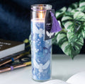 Night Owl Lavender Scented Candle - lit on desk with books and pens
