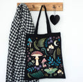 Forest Floor Tote Bag - hanging on wooden peg rail with scarf