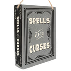 Spells and Curses hanging sign angled view showing spine detail