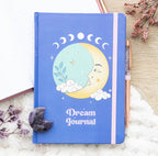 Moon Dream Journal styled flat lay with amethyst crystal moon and dried flowers