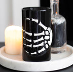 Skeleton Hand Ceramic Oil Burner lifestyle shot with candle on marble tray