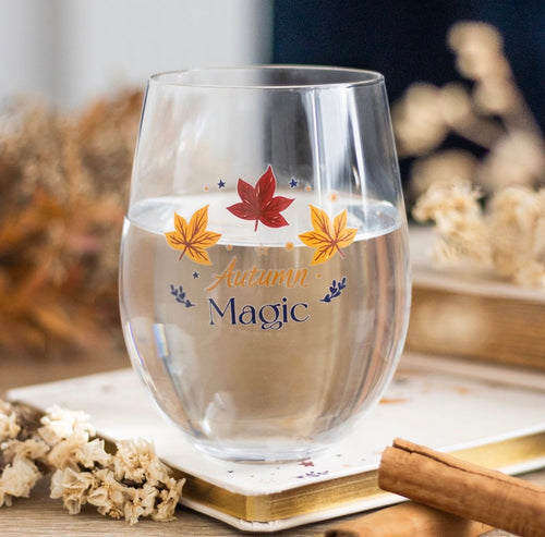 Autumn Magic Stemless Wine Glass lifestyle shot on wooden surface with dried flowers