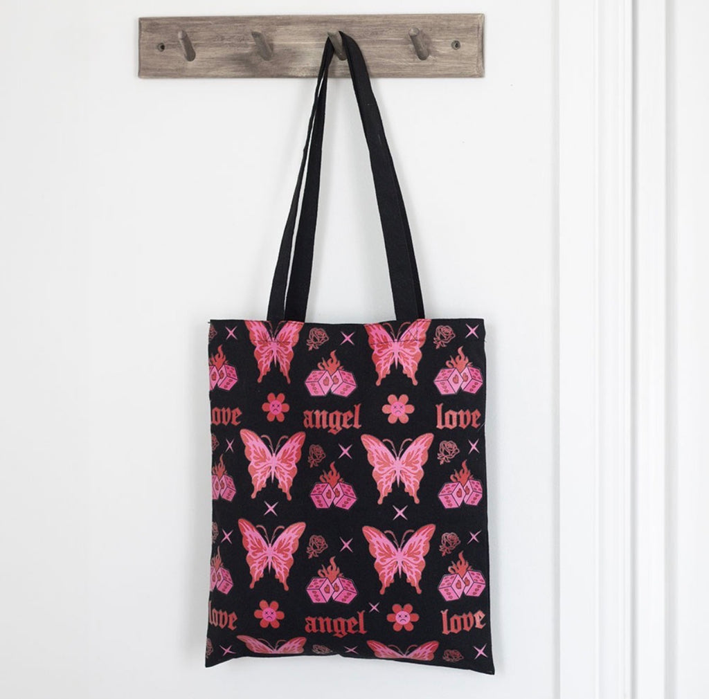 Flaming Butterfly Tote Bag hanging on door hook lifestyle shot