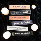 Witchy Book Spine Bookmarks Set of 6 lifestyle flat lay on black velvet with candles