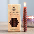 Blessed Bee 6 Beeswax Spell Candles lifestyle shot with lit candle and amethyst crystal