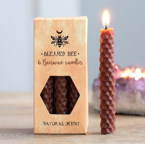 Blessed Bee 6 Beeswax Spell Candles lifestyle shot with lit candle and amethyst crystal