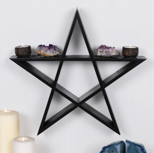 Black Pentagram Wall Shelf lifestyle shot on white wall styled with amethyst crystals and tealight holders