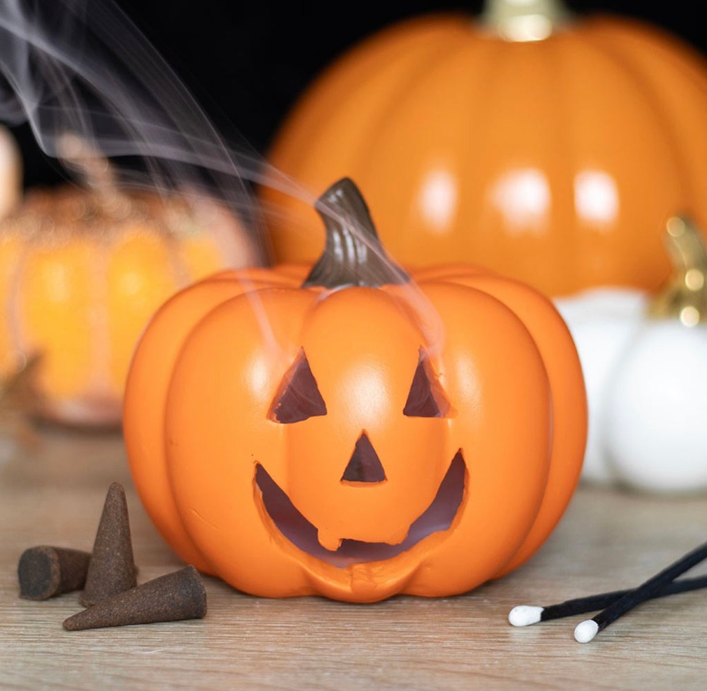 Jack-o'-Lantern Pumpkin Backflow Incense Burner - lifestyle shot with smoke drifting from carved face