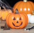 Jack-o'-Lantern Pumpkin Backflow Incense Burner - lifestyle shot with smoke drifting from carved face