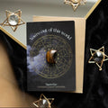Tigers Eye Crescent Moon Crystal Card styled flat lay with gold star decorations