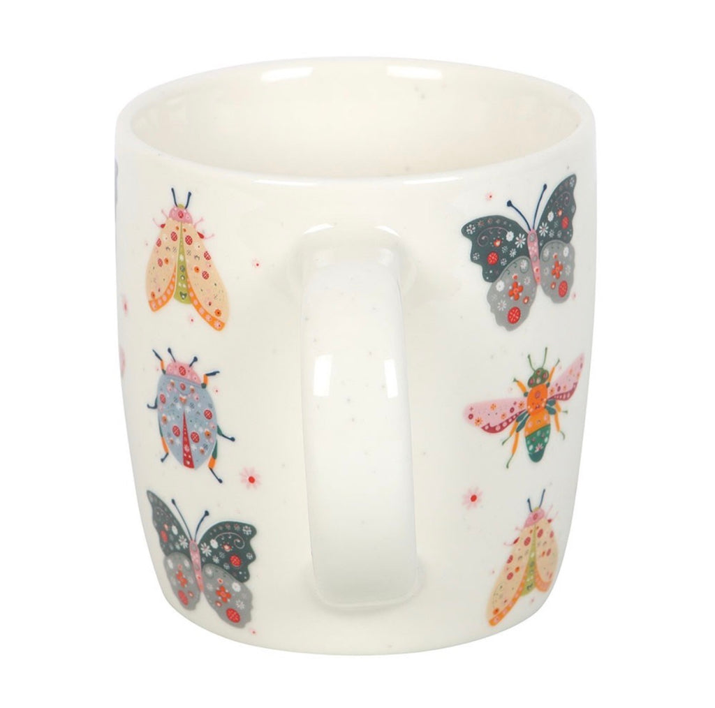 Butterfly and Bug Garden Ceramic Mug - back view on white background