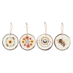 Summer Solstice Wood Slice Hanging Ornaments - all 4 designs flat lay on white background: Bee Wreath, Sunflower Pentagram, Moon & Flowers, Bumble Bee