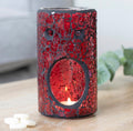 Red Pillar Crackle Glass Oil Burner - lifestyle shot lit on wooden surface