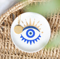 All Seeing Eye Necklace and Jewellery Dish Gift Set - lifestyle shot on rattan surface