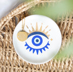 All Seeing Eye Necklace and Jewellery Dish Gift Set - lifestyle shot on rattan surface