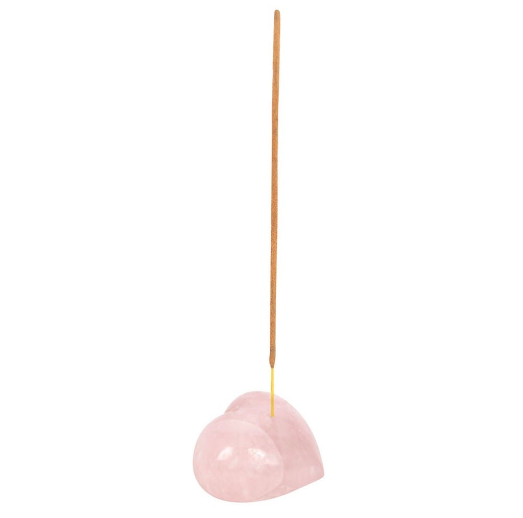 Rose Quartz Heart Incense Holder with incense stick inserted on white background