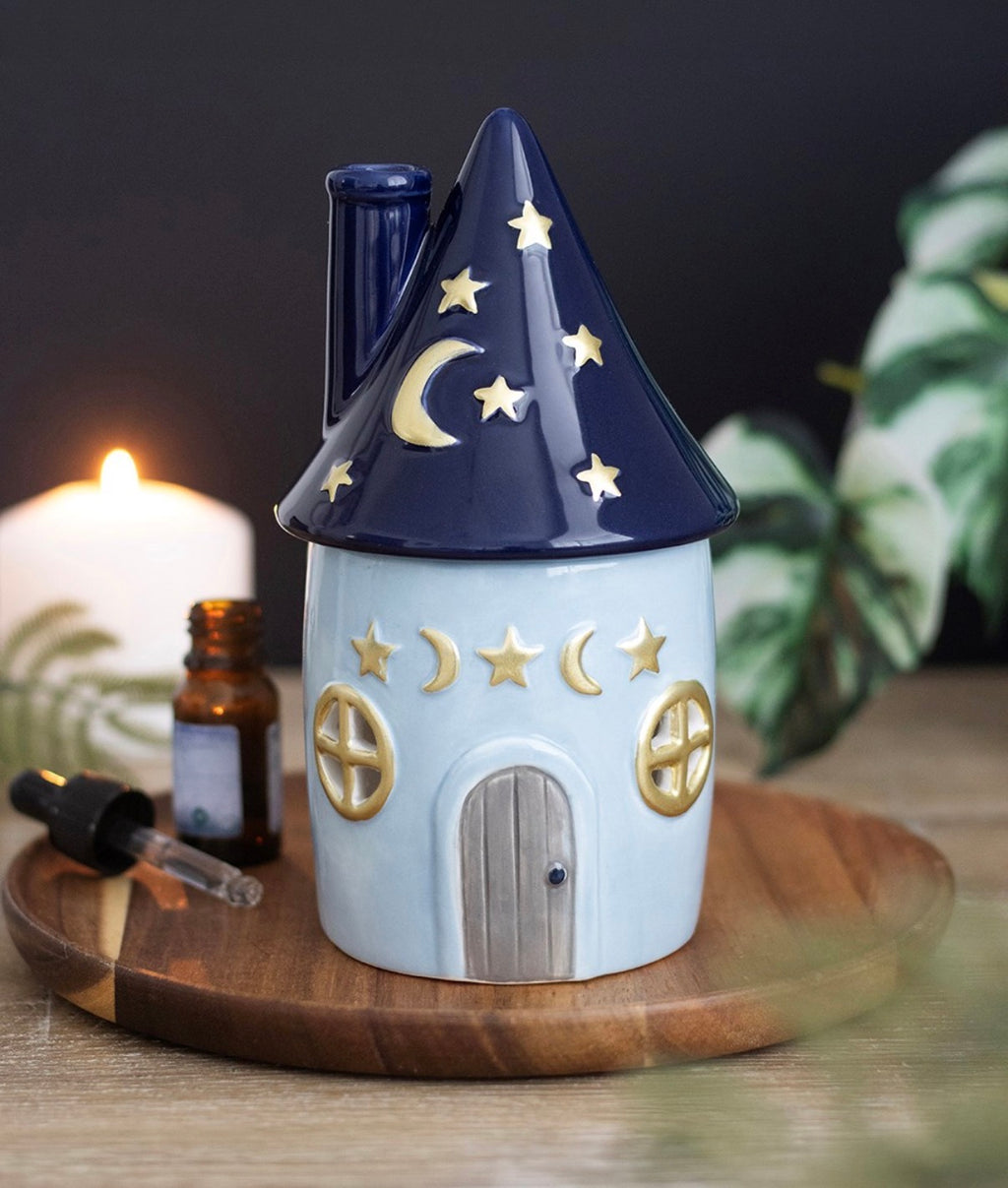 Celestial Cottage Ceramic Oil Burner lifestyle shot on wooden tray with candle and essential oil