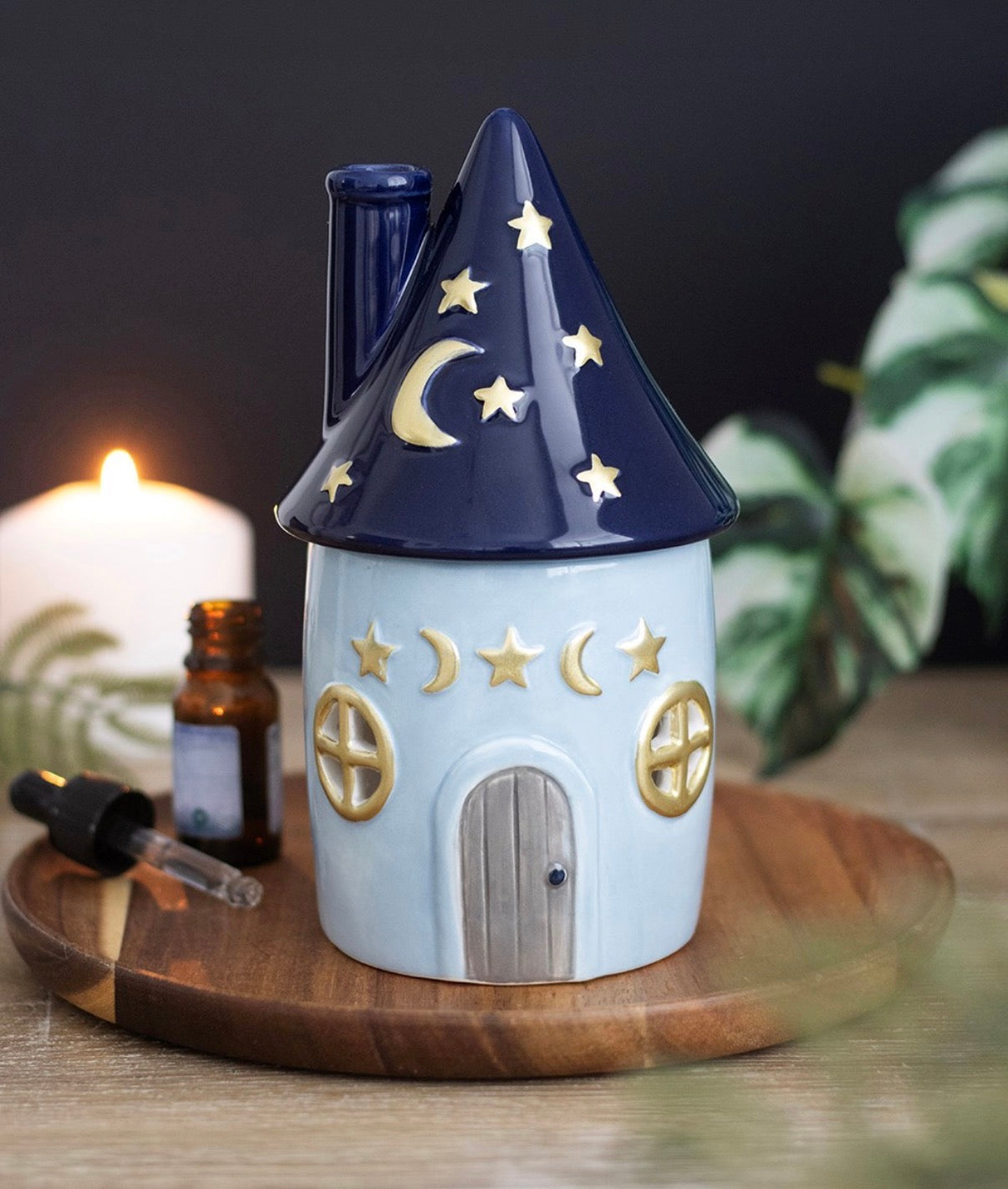 Celestial Cottage Ceramic Oil Burner lifestyle shot on wooden tray with candle and essential oil