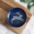 Leaping Hare Ceramic Trinket Dish lifestyle shot on wooden board with gold necklace