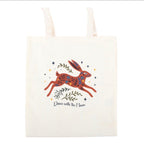 Dance with the Moon Jumping Hare Tote Bag angled view white background showing hare and Dance with the Moon script