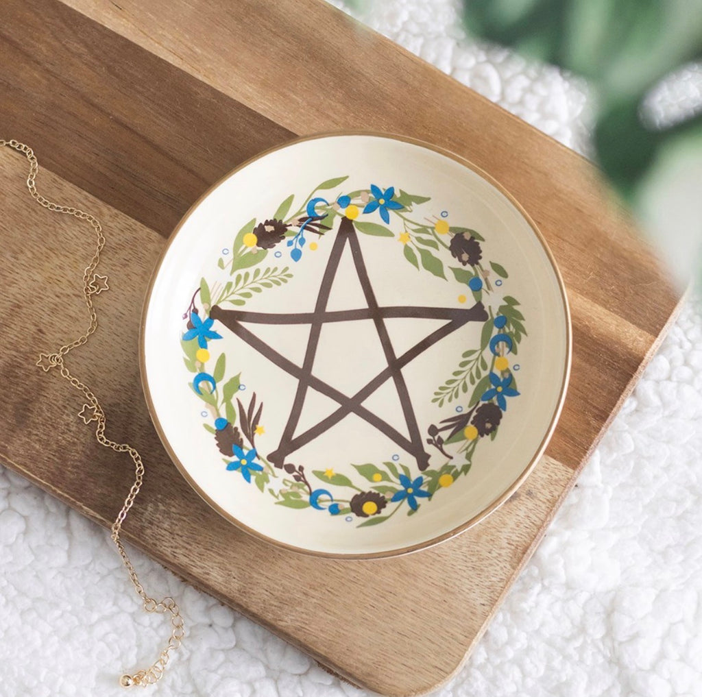 Solstice Wreath Trinket Dish lifestyle shot on wooden board with gold necklace