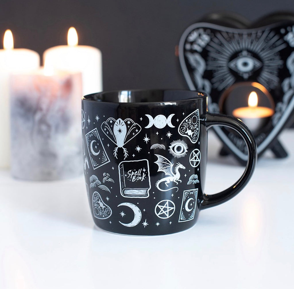Spellbound Secrets Ceramic Mug lifestyle shot with candles and planchette holder