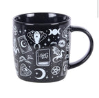 Spellbound Secrets Ceramic Mug front view white background showing spell book and moth
