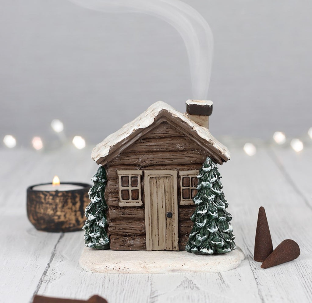 Smoking Log Cabin Incense Cone Burner - styled shot with smoke and candle