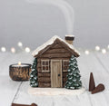 Smoking Log Cabin Incense Cone Burner - styled shot with smoke and candle