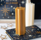 Starry Night star shaped candle gold - close up top white background