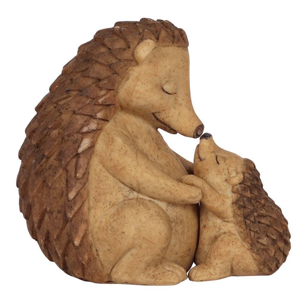 Hedgehog and hoglet figurine front view on white background showing mother and baby noses touching