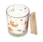 Spiced Vanilla celestial scented candle close up overhead view showing wooden lid off and wax with moon and leaf print glass