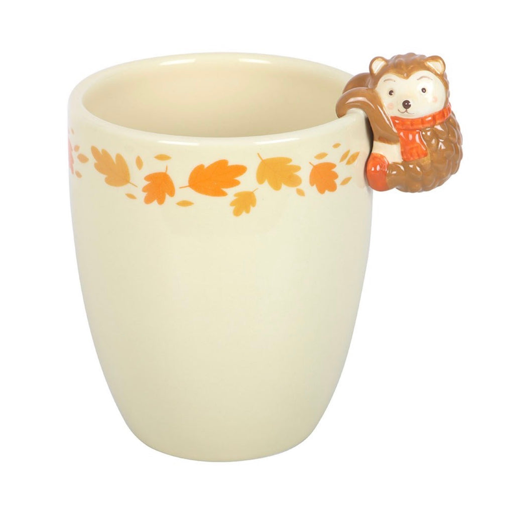 Hedgehog autumn leaves ceramic plant pot front view on white background showing hedgehog on rim