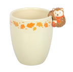 Hedgehog autumn leaves ceramic plant pot front view on white background showing hedgehog on rim