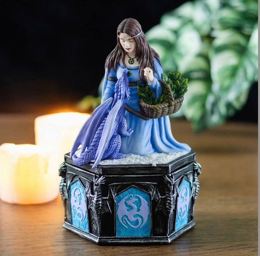 Anne Stokes Four Seasons Dragon Winter trinket box with candles in moody dark setting