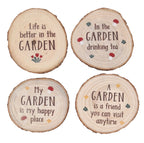 Four round wood slice coasters with hand-painted garden quotes and mushroom and flower illustrations, shown on a white background