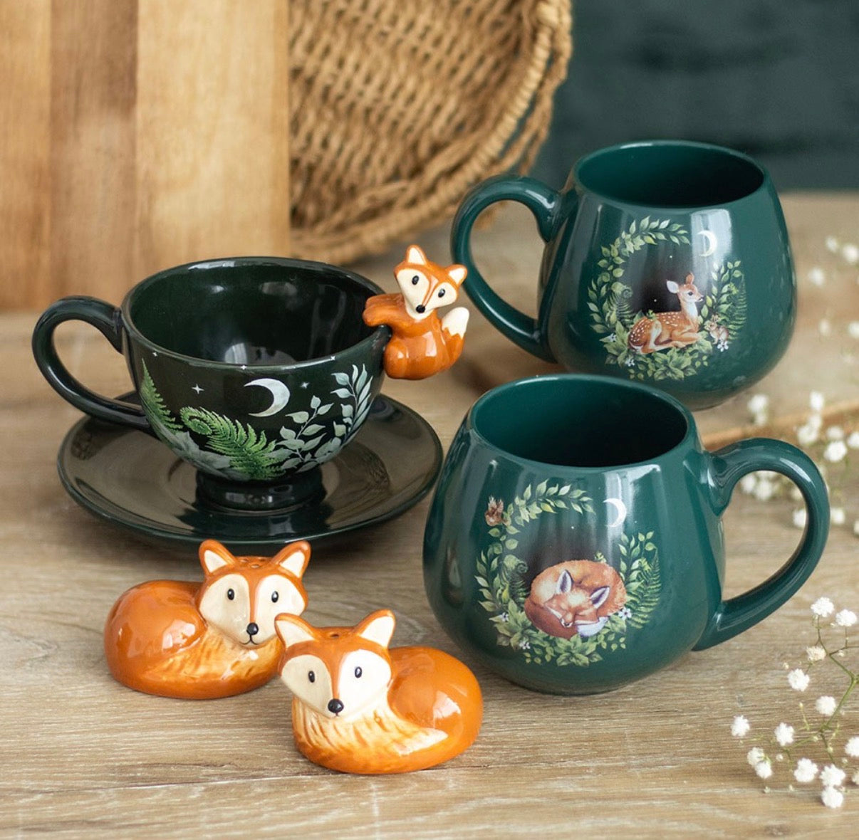 Enchanted Forest collection flat lay showing sleeping fox mug, fawn mug, fox cup and saucer, and fox salt and pepper shakers