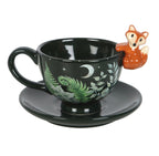 Dark green ceramic fox tea cup and saucer with botanical fern and leaf design, white background product shot