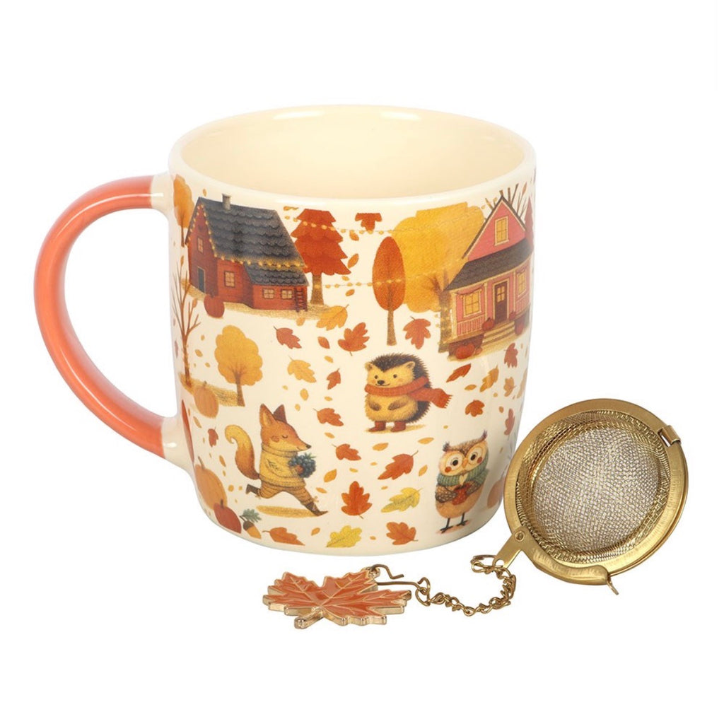 Cream ceramic autumn woodland mug with terracotta handle and gold mesh tea strainer set, white background product shot