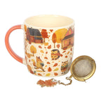 Cream ceramic autumn woodland mug with terracotta handle and gold mesh tea strainer set, white background product shot