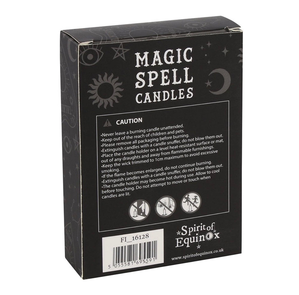 Hand holding a box of black Protection spell candles beside lit candles and dried flowers