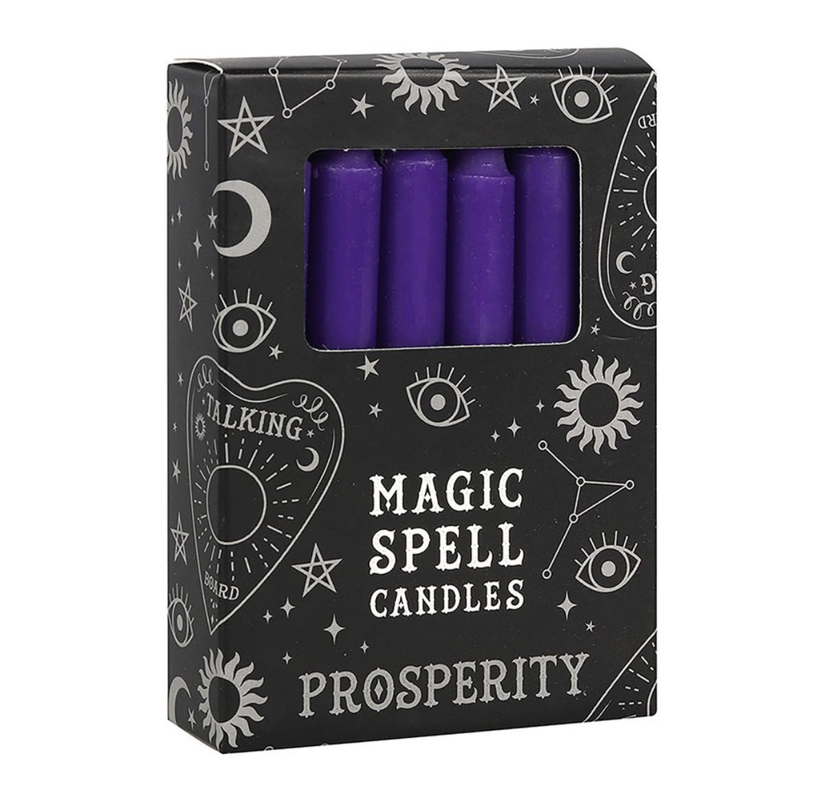 Hand holding a box of purple Prosperity spell candles beside lit candles and dried flowers
