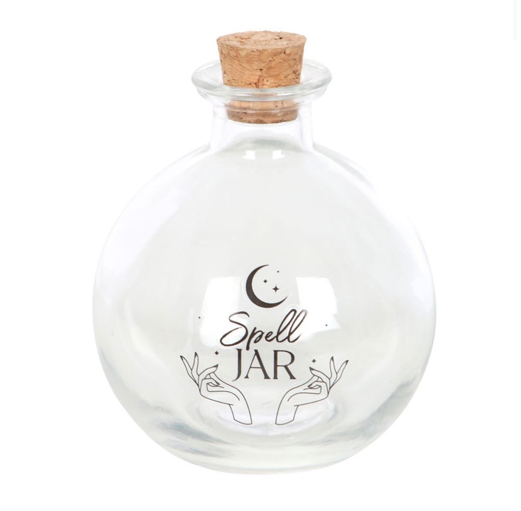 Spell jar with the cork stopper removed beside it
