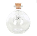 Clear glass spell jar with cork in place, showing the moon and hands design