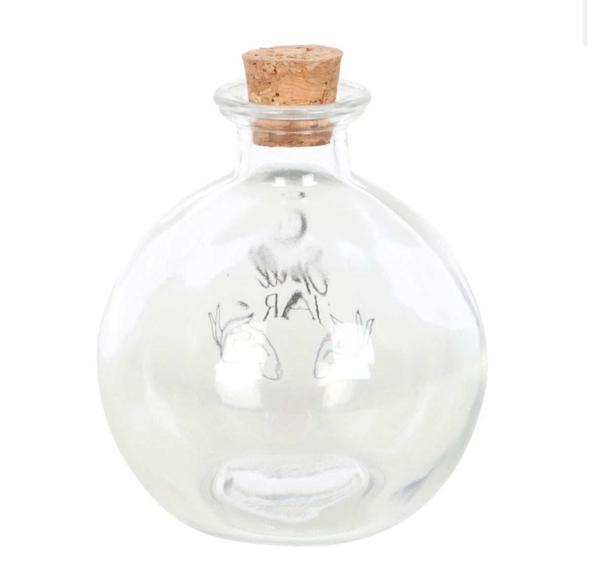 Clear glass spell jar with cork in place, showing the moon and hands design