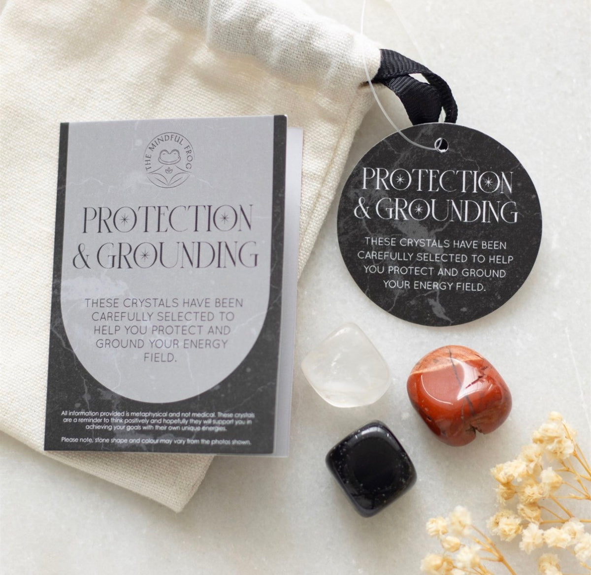 Information card explaining red jasper, clear quartz and black obsidian meanings and affirmations